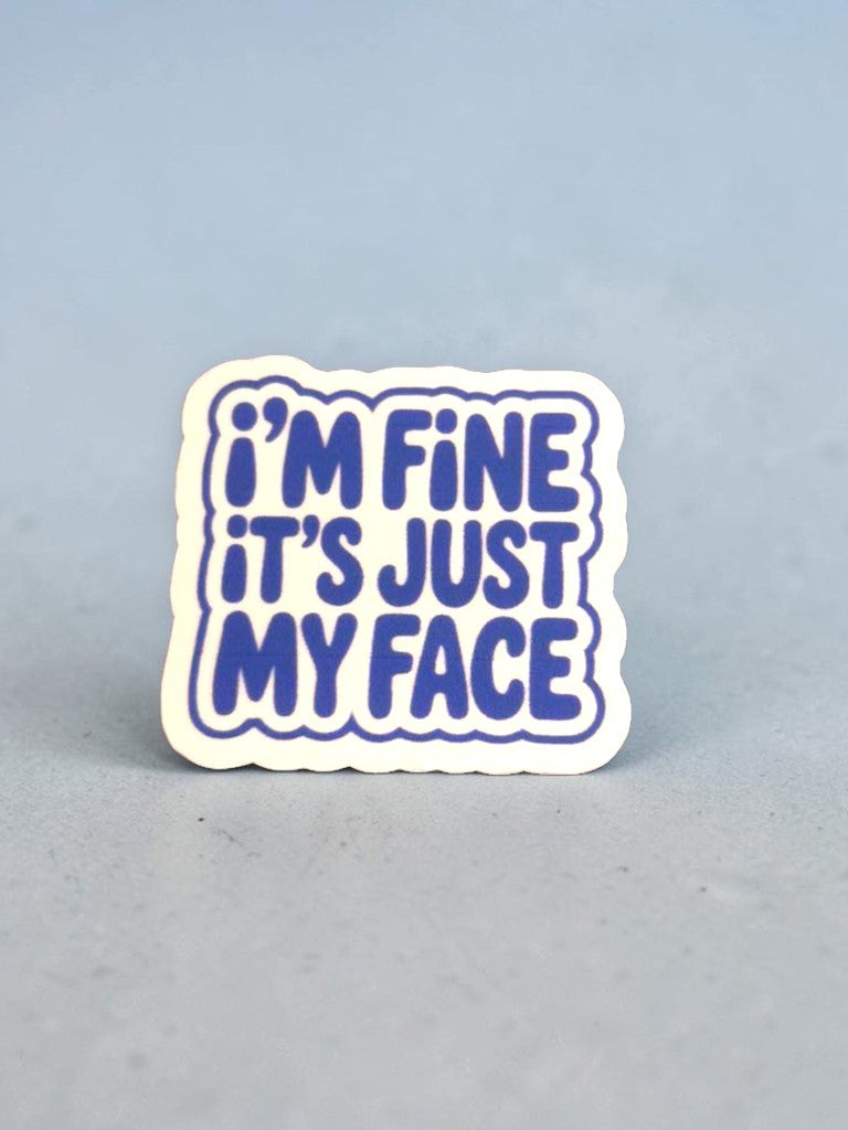 permanent sticker with 'I'm fine it's just my face' text on a light gray background