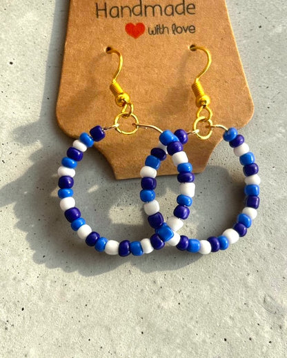 close up blue and white earrings beaded jewelry aesthetic detail design