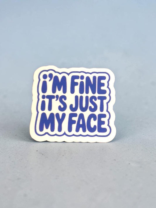 permanent sticker with 'I'm fine it's just my face' text on a light gray background