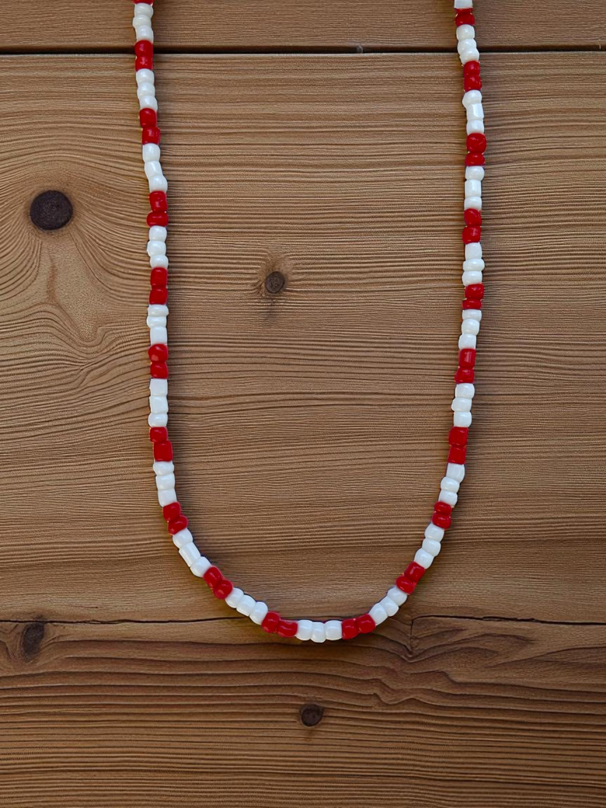 red white simple necklace flat lay minimalist beaded jewelry design