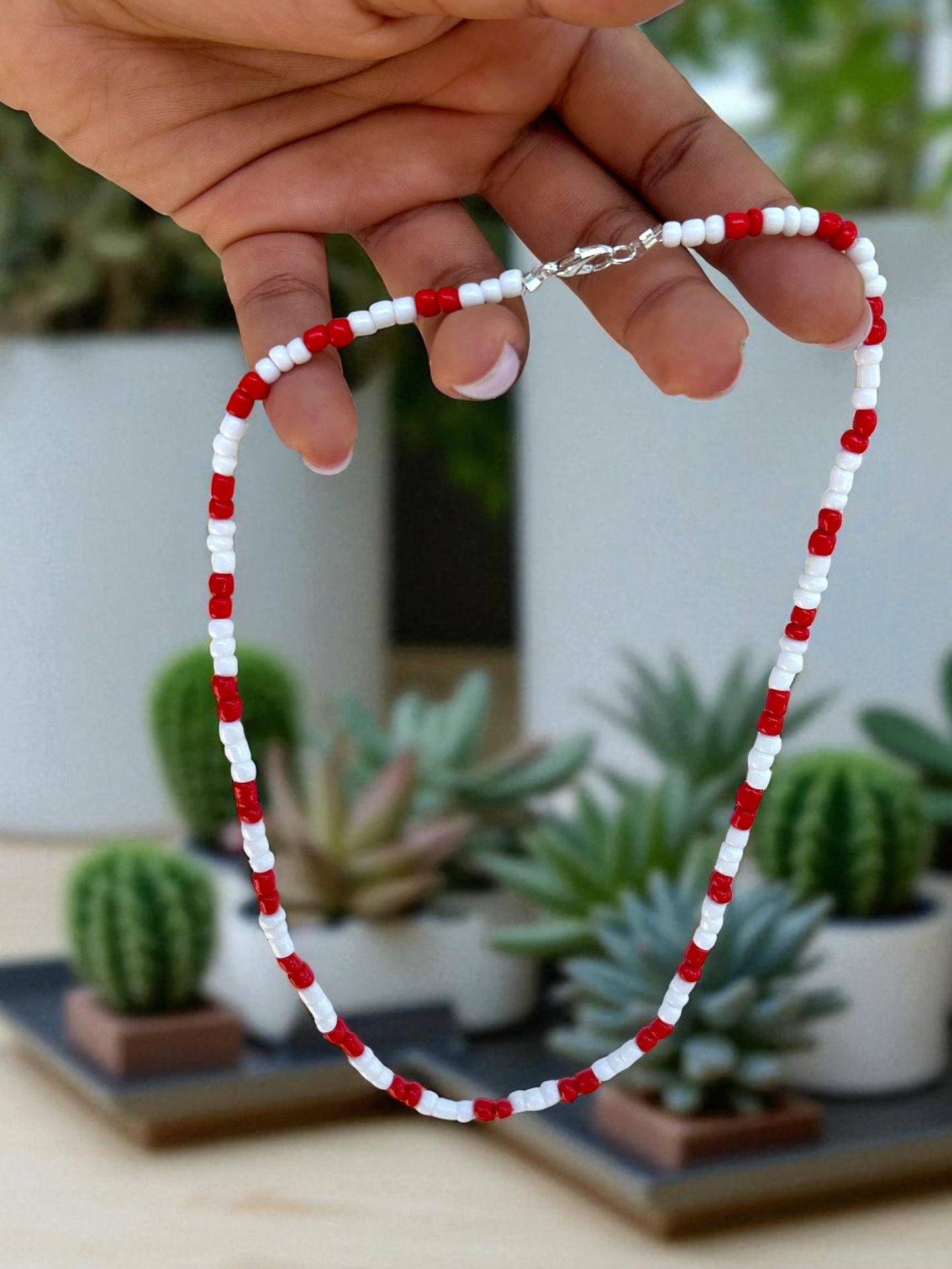 close up red white necklace beaded minimalist jewelry detail design