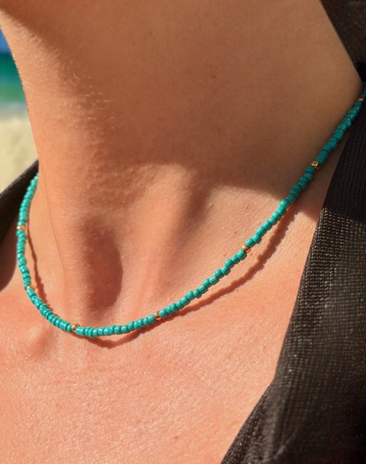 sea breeze inspired handmade necklace with blue tones styled beach fashion jewelry on model