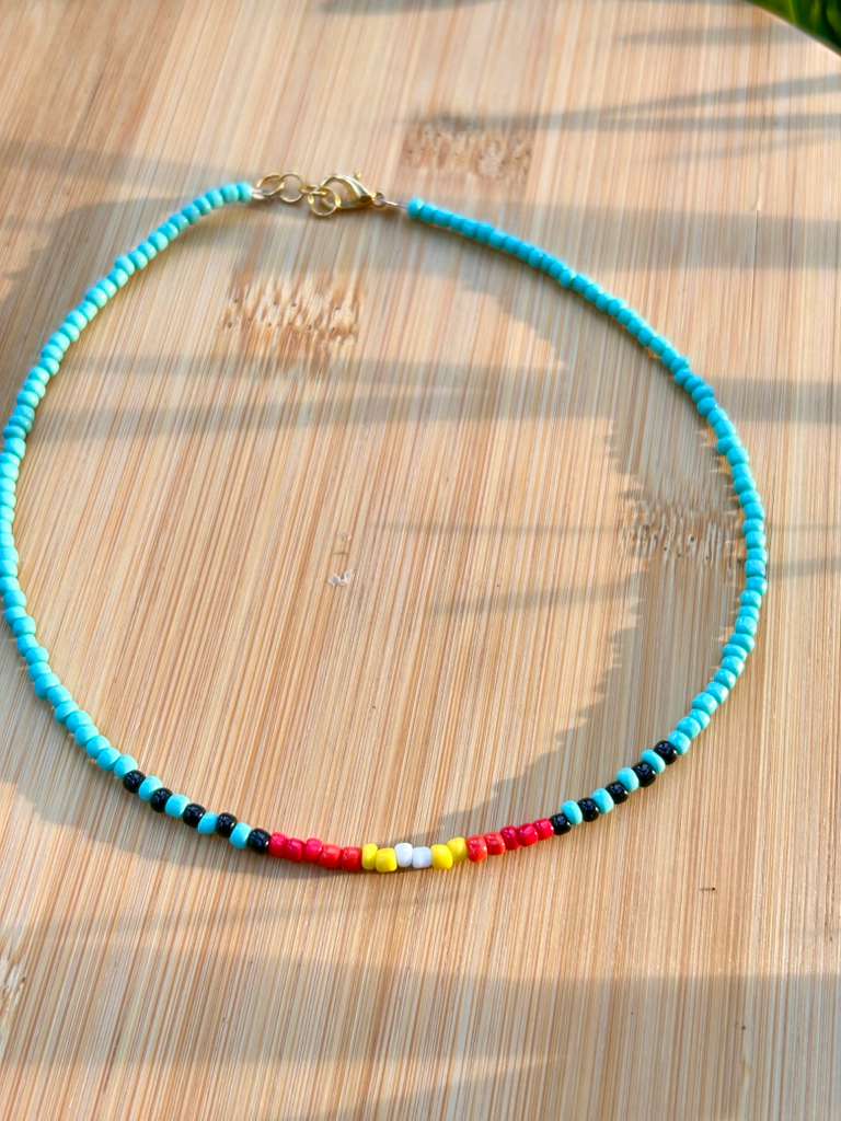 island inspired beaded necklace with bright colors summer aesthetic jewelry worn on model