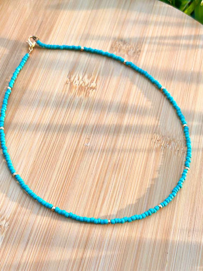 lightweight ocean breeze necklace with handmade blue beads aesthetic summer beach jewelry styled on model