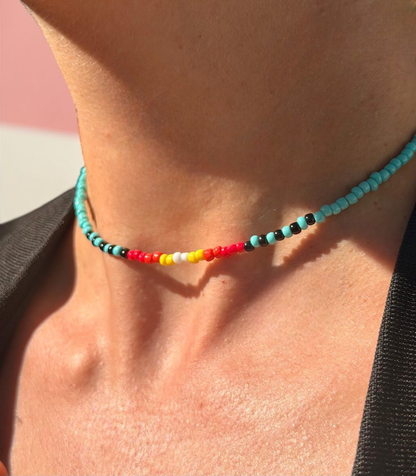 colorful handmade island pop necklace tropical fashion jewelry styled flat lay